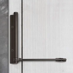 Bras à ressort ferme porte, a corps très fin en Aluminium anodisé noir
